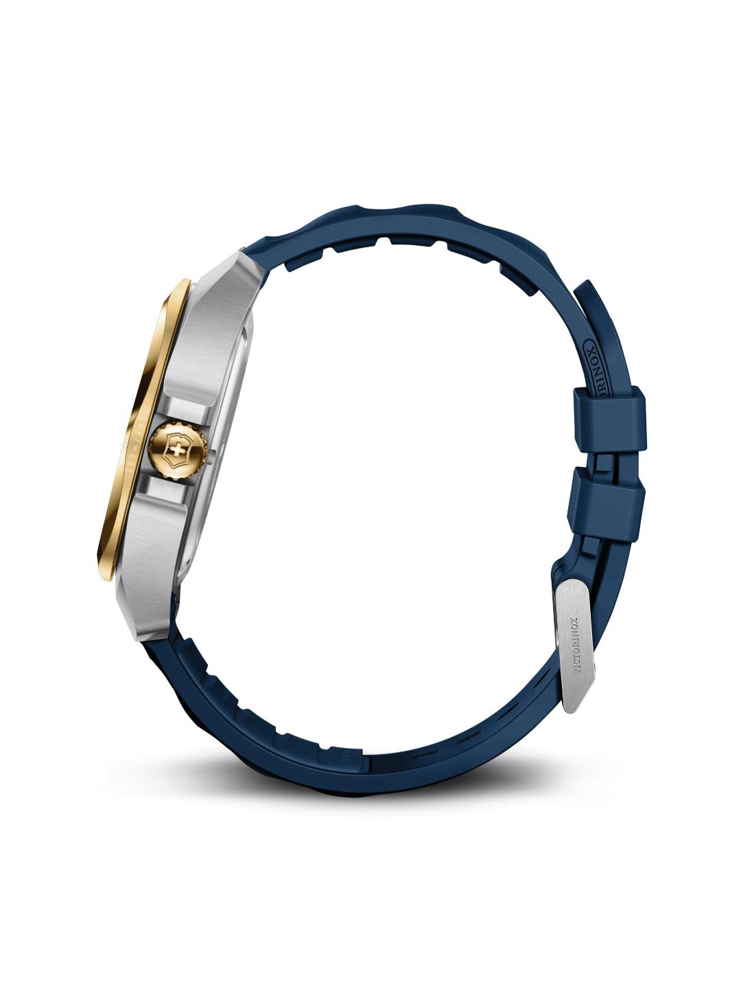 Close-up of a watch with a blue strap and gold and silver case on a white background