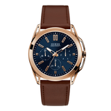 A Guess brand men's multi-function watch with a blue dial, brown leather band, and rose gold case.