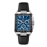 A men's chronograph watch featuring a square silver-tone stainless steel case, a blue dial with white sub-dials and Roman numeral hour markers, and a black leather strap with white stitching.