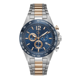 A men's two-tone analog watch with a silver and rose gold metal link bracelet, a blue dial with gold-tone subdials and markers, and a matching blue and silver bezel.